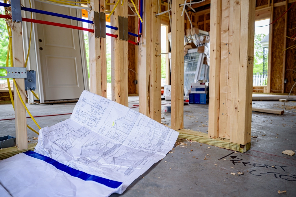 Crew framing a building on a job site